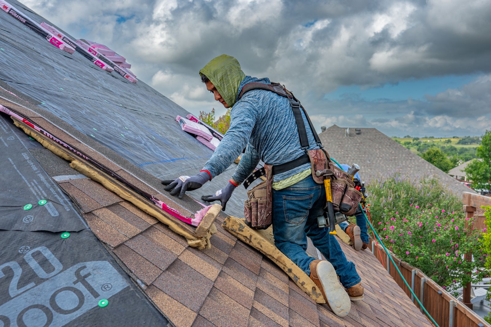 Roofer working on an asphalt-shingle roof